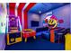 Fun game room with arcade games and seating at 2133 Pine Oak Loop, Davenport, FL 33837