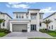 Modern two-story house with gray exterior at 2133 Pine Oak Loop, Davenport, FL 33837