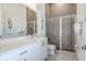 Modern bathroom with white vanity and a large walk-in shower at 2133 Pine Oak Loop, Davenport, FL 33837