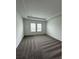 Large bedroom with carpeted floors and dual windows at 2720 Pierr St, Davenport, FL 33837