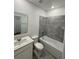 Bathroom with a tub, toilet and vanity with modern finishes at 2720 Pierr St, Davenport, FL 33837
