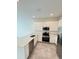 Modern kitchen with stainless steel appliances and island at 2720 Pierr St, Davenport, FL 33837