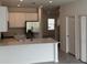 Modern kitchen with stainless steel appliances and island at 2720 Pierr St, Davenport, FL 33837