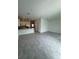 Open living room with tile floors and kitchen views at 2720 Pierr St, Davenport, FL 33837