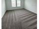 Bright bedroom featuring neutral carpeting and large windows at 2720 Pierr St, Davenport, FL 33837