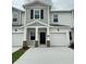 Two-story home with two-car garage and landscaping at 2720 Pierr St, Davenport, FL 33837