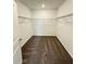 Spacious walk-in closet with double hanging rods and neutral carpeting at 2720 Pierr St, Davenport, FL 33837