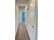 Clean hallway with neutral carpeting and access to bedrooms at 2720 Pierr St, Davenport, FL 33837