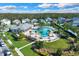 Community pool with lounge chairs and a clubhouse at 3004 Ballad Rd, Kissimmee, FL 34746
