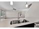 Modern kitchen island with double sink and stainless steel faucet at 3004 Ballad Rd, Kissimmee, FL 34746