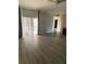 Living room with hardwood floors and sliding glass doors at 3077 Brenton Manor Loop, Winter Haven, FL 33881