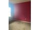 Cozy bedroom with neutral carpeting and pink walls at 3077 Brenton Manor Loop, Winter Haven, FL 33881