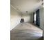 Spacious living room with hardwood floors and large windows at 3077 Brenton Manor Loop, Winter Haven, FL 33881