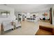 Open concept kitchen features an island with seating and stainless steel appliances at 4917 Vellacito Way, Davenport, FL 33897