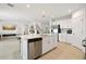 Modern kitchen with island, stainless steel appliances, and white cabinetry at 4917 Vellacito Way, Davenport, FL 33897