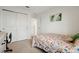 Bedroom with floral bedding and a desk at 4917 Vellacito Way, Davenport, FL 33897