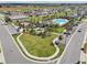 Community pool with lounge chairs and a covered area at 4917 Vellacito Way, Davenport, FL 33897