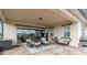 Covered patio with seating area and sliding glass doors at 5075 Twin Lakes Blvd, St Cloud, FL 34772