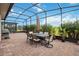 Relaxing screened patio featuring dining area and outdoor grill at 5075 Twin Lakes Blvd, St Cloud, FL 34772