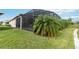 Spacious backyard with screened enclosure and lush landscaping at 5075 Twin Lakes Blvd, St Cloud, FL 34772