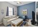 Cozy sitting area with sofa, chair, and coastal decor at 5075 Twin Lakes Blvd, St Cloud, FL 34772