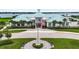 Community clubhouse with lake view and flagpole at 5075 Twin Lakes Blvd, St Cloud, FL 34772
