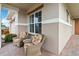 Front porch with wicker chairs and a side view of the home at 5075 Twin Lakes Blvd, St Cloud, FL 34772