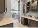 Butler's pantry with glass-front cabinets, quartz countertops, and ample storage at 5075 Twin Lakes Blvd, St Cloud, FL 34772