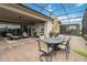 Covered patio boasts dining area, grill, and screened enclosure at 5075 Twin Lakes Blvd, St Cloud, FL 34772