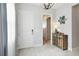 Bright entryway with light gray walls, wood-look tile floors, and a stylish console table at 5075 Twin Lakes Blvd, St Cloud, FL 34772