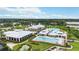 Community pool, lap pool, and clubhouse with lake views at 5075 Twin Lakes Blvd, St Cloud, FL 34772