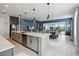 Modern kitchen with large island, stainless steel appliances, and plenty of cabinet space at 5075 Twin Lakes Blvd, St Cloud, FL 34772