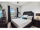 Bedroom with a king-size bed and black and white decor at 5075 Twin Lakes Blvd, St Cloud, FL 34772