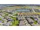 Aerial view of a house in a residential community by a lake at 5075 Twin Lakes Blvd, St Cloud, FL 34772