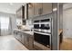 Modern kitchen with stainless steel appliances and gray cabinets at 5075 Twin Lakes Blvd, St Cloud, FL 34772