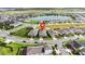 Aerial view of a house located in a residential neighborhood near a lake at 5075 Twin Lakes Blvd, St Cloud, FL 34772