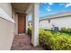 Side porch with brick flooring, leading to the backyard at 5075 Twin Lakes Blvd, St Cloud, FL 34772