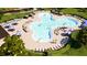 Resort-style community pool with plenty of lounge chairs and umbrellas at 5422 Catmint Dr, Lake Hamilton, FL 33851