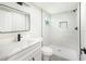 Clean bathroom with white vanity and walk-in shower at 639 Shore Acres Dr, Lakeland, FL 33801