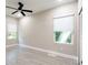 Bright bedroom with ceiling fan and two windows at 639 Shore Acres Dr, Lakeland, FL 33801
