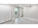 Bright bedroom with grey tile floors and white shutters at 639 Shore Acres Dr, Lakeland, FL 33801