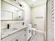 Double vanity bathroom with white cabinets and marble countertops at 639 Shore Acres Dr, Lakeland, FL 33801