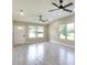 Bright and airy living room with gray tile floors and recessed lighting at 639 Shore Acres Dr, Lakeland, FL 33801