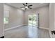 Spacious bedroom with sliding glass doors leading to backyard at 639 Shore Acres Dr, Lakeland, FL 33801