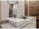 Bathroom with granite countertop, double sinks, and large mirror at 7585 Sunny Dreams Ln, Kissimmee, FL 34747