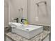 Modern bathroom with a single sink, granite countertop, and a large mirror at 7585 Sunny Dreams Ln, Kissimmee, FL 34747