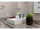 Bathroom with modern vanity and granite countertop at 7585 Sunny Dreams Ln, Kissimmee, FL 34747