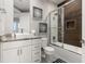 Clean bathroom with white cabinets and walk-in shower at 7585 Sunny Dreams Ln, Kissimmee, FL 34747