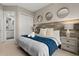 Spacious bedroom with ensuite bathroom and wood-like headboard at 7585 Sunny Dreams Ln, Kissimmee, FL 34747