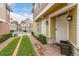 Inviting entryway with brick walkway leading to front door at 7585 Sunny Dreams Ln, Kissimmee, FL 34747